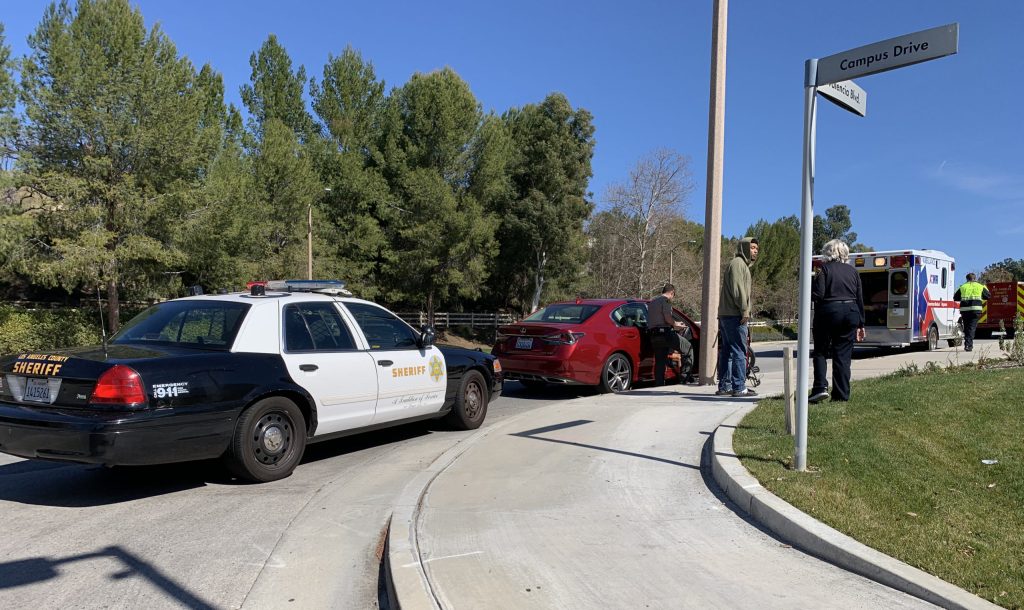 Car hits cyclist near Lot 7