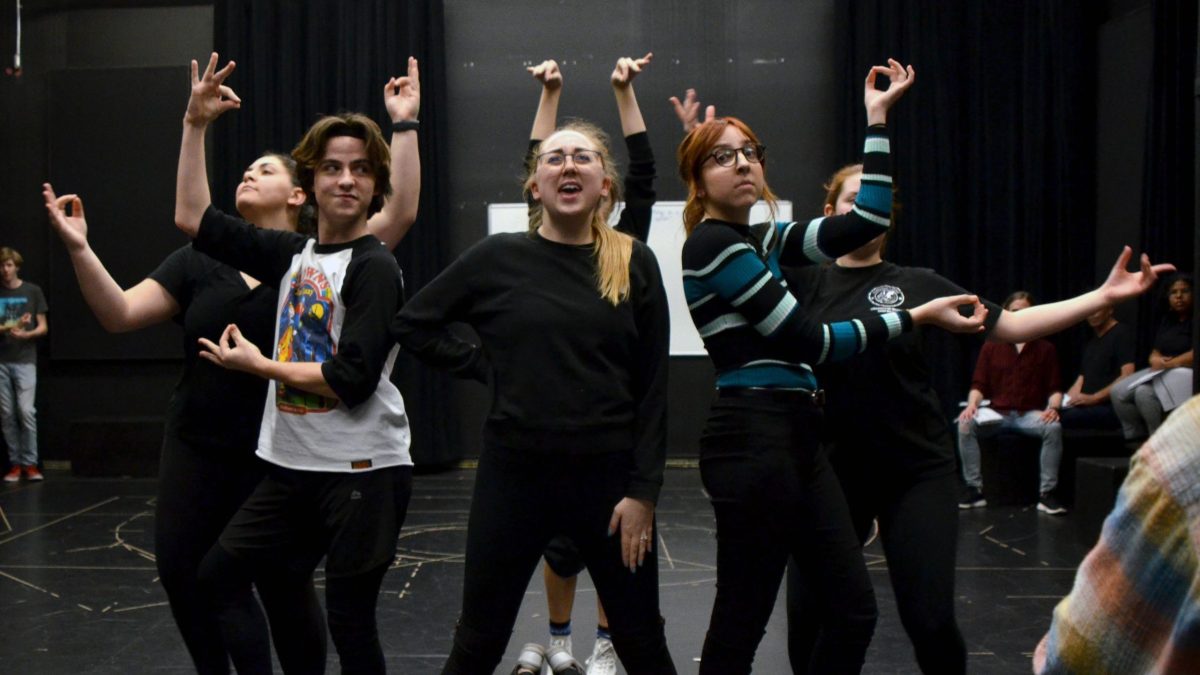 Savannah McCarter and the cast of Pippin rehearse a dance number.