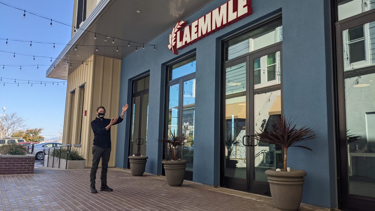 Cassie Gratton, Location Manager, gestures toward the front of the Laemmle Newhall theater