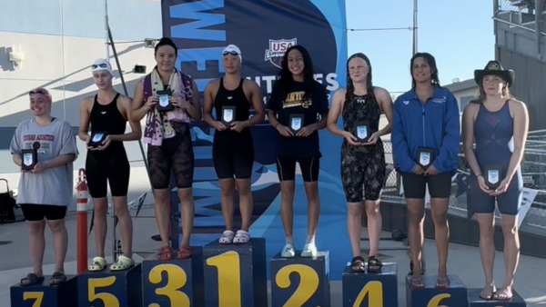 Emma Hussein placing 2nd at a college swim event