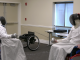 Two wheelchair fencers in protective gear face off with foils during a match, demonstrating adaptive sports at the Triumph Foundation’s Wheelchair Sports Festival.